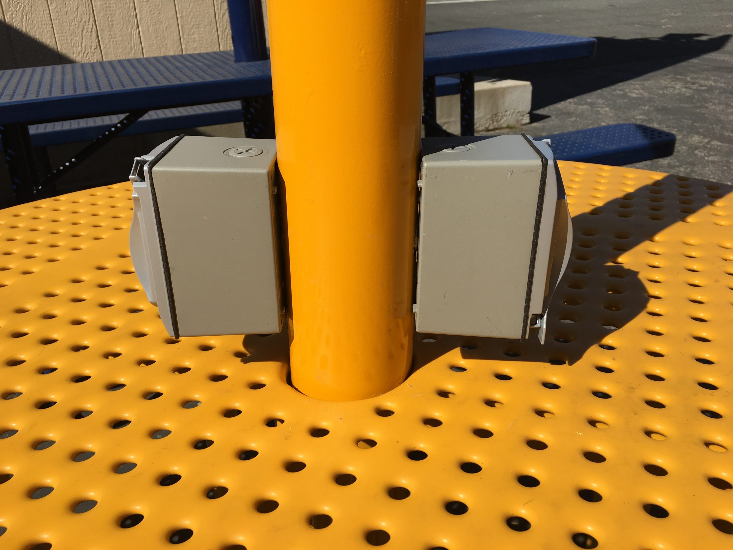 USB and 120 volt outlets on a ShadeCharger solar powered picnic table