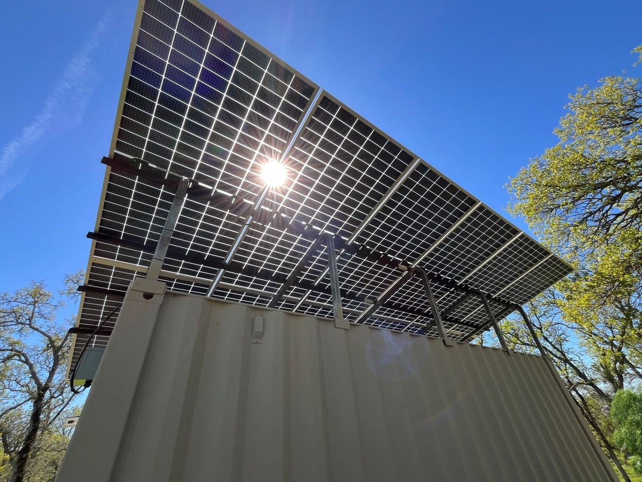 Bifacial solar panels on shipping container