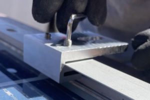 Sola Clamp slips over underside of module frame