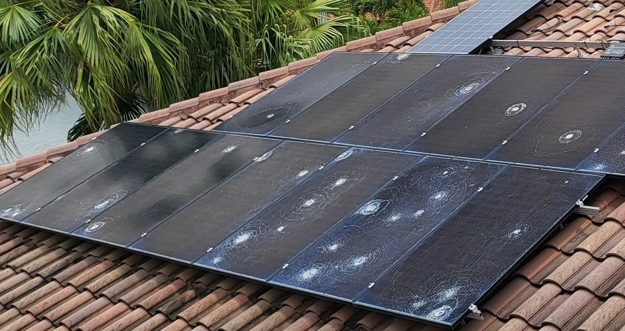 Damaged solar panels exposed to repeated physical impacts